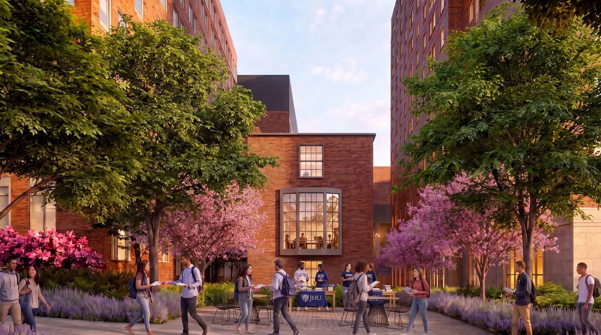Students gather in a courtyard at Johns Hopkins University with trees and modern buildings.