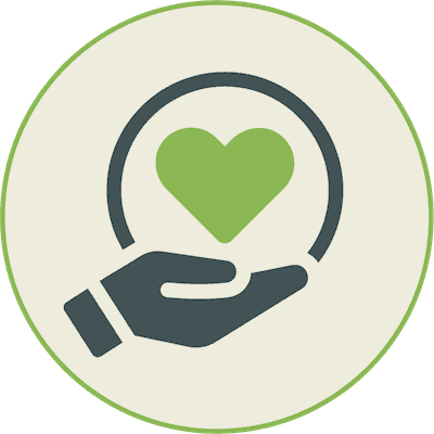 Hand holding a heart symbol representing community and care at Maslow's Campus.